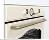 Close-up of the front panel of a cream-colored oven, showing the control knobs and handle. Produktbild-Vorschau