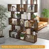 A bookshelf used as a room divider in a living space with a sofa in the background. Anteprima dell’immagine prodotto