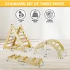 A set of wooden climbing toys for children, including a triangle climber, a climbing arch, and a balance board, displayed on a light-colored floor with dimensions indicated. Produktbild-Vorschau