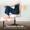 A person is sitting on a pink ergonomic chair with a lumbar support cushion. Produktbild-Vorschau
