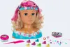 A styling head with accessories laid out around it. Produktbild-Vorschau