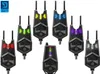 A collection of fishing bite alarms, each lit with a different color LED. Produktbild-Vorschau