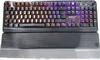A top-down view of a black mechanical gaming keyboard with RGB backlighting and a black wrist rest. Produktbild-Vorschau