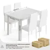 A white dining table and four chairs with dimensions indicated by measurement lines and text. Two cardboard boxes are shown in the foreground. Produktbild-Vorschau