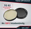 A black twist-off lid for a jar, with a label showing its specifications and a description of its heat resistance. Produktbild-Vorschau
