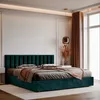 A plush teal bed with a fluted headboard, layered with blankets and pillows, set in a modern, softly lit bedroom with large windows and draped curtains. Anteprima dell’immagine prodotto