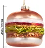 A glass ornament shaped like a hamburger, hanging from a string. Voir les images du produit