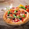 A pizza is presented on a wooden board, surrounded by fresh ingredients like tomatoes, peppers, and mushrooms, on a wooden table. Anteprima dell’immagine prodotto