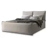 A bed with pillows and a blanket on a white background. Produktbild-Vorschau
