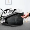 A hand is shown filling a steam generator iron with water. Produktbild-Vorschau