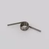A metal spring on a plain background. Produktbild-Vorschau
