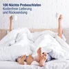 Two people are lying in bed under white duvets, with their feet visible. One person is holding a white mug. Produktbild-Vorschau