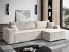 A modern living room with a beige corduroy sectional sofa, a coffee table, and artwork on the wall. Produktbild-Vorschau