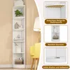 A white corner bookshelf is shown in a room with a yellow chair and a lamp. There are also inset images highlighting features of the bookshelf. Produktbild-Vorschau