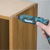 A hand is using a cordless screwdriver to assemble a wooden cabinet. Podgląd zdjęcia produktu