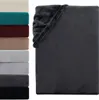 A stack of folded blankets in various colors next to a folded dark gray blanket. Produktbild-Vorschau