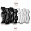 A product shot of two geometric wall panels, one black and one white, with a logo and text above and below. Produktbild-Vorschau