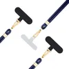 Three instances of a dark blue lanyard with a gold clip and a black attachment piece, arranged diagonally on a white background. Produktbild-Vorschau