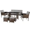 A polyrattan garden furniture set including a sofa, two armchairs, a table, and two ottomans, all with gray cushions, displayed on a white background.
