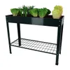 A dark green raised garden bed filled with lettuce and chives, shown on a white background. Produktbild-Vorschau