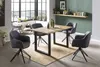 A dining room setting with a table and chairs. Produktbild-Vorschau