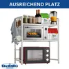 A white, three-tier kitchen shelf unit holding two microwaves, jars of spices, bottles of wine, bags of product, and kitchen utensils. Anteprima dell’immagine prodotto