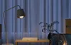 A desk setup with a lamp, a plant, and a computer monitor. Náhled obrázku produktu