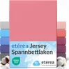 A stack of colorful fitted sheets with a pink one prominently displayed in the front. Produktbild-Vorschau