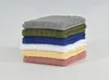 A stack of six folded towels in different colors. Podgląd zdjęcia produktu