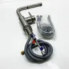 A kitchen faucet and its accessories are laid out on a white surface. Produktbild-Vorschau