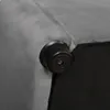 A close-up view of the corner of a gray upholstered bed frame, showing a black plastic foot. Produktbild-Vorschau