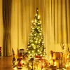 A decorated Christmas tree with gifts and festive figures in a warm, indoor setting. Voir les images du produit