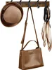 A wooden coat rack with a hat, handbag, and scarf hanging on it. Produktbild-Vorschau