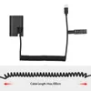 A black USB-C dummy battery coupler with a coiled cable and a USB-C connector. Produktbild-Vorschau