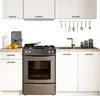 A modern kitchen setup with white cabinets, a stainless steel stove and coffee maker, and a sink. Náhľad obrázku produktu