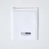 A white folded textile product on a white background. Produktbild-Vorschau