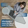 A woman is ironing clothes on an ironing board. Produktbild-Vorschau