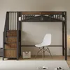 A loft bed with stairs and storage is shown in a room with a white chair and a shopping bag on the floor. Náhled obrázku produktu