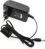 A black AC adapter with a European plug and a coiled cable. Produktbild-Vorschau