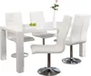 A white dining table with four white chairs, set against a white background. There are two green apples on a plate on the table, and a single pink rose in a white vase. Produktbild-Vorschau