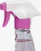 Close-up of a pink and white spray bottle with pink liquid inside. Podgląd zdjęcia produktu