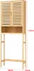 A tall, narrow bamboo cabinet designed to fit over a toilet, with slatted doors and an open shelf. Náhľad obrázku produktu