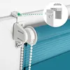 Close-up of a roller blind mechanism attached to a window frame, with an inset showing a measurement detail. Produktbild-Vorschau
