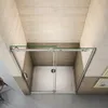 A modern shower enclosure with sliding glass doors inside a tiled bathroom. Produktbild-Vorschau