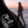 A smartwatch is shown in the foreground with a person running on a beach in the background during sunset. Produktbild-Vorschau