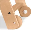 A close-up view of the wooden structure and wheels of a high chair. Podgląd zdjęcia produktu