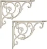 Two white ornate shelf brackets are shown against a white background. Náhľad obrázku produktu