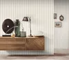 A modern living room shelf with decorative items and a lamp. Náhľad obrázku produktu