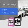 Two ink cartridges are shown in the foreground, with a modern office space in the background. Produktbild-Vorschau