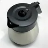 A top-down view of a coffee pot on a white surface. Voir les images du produit